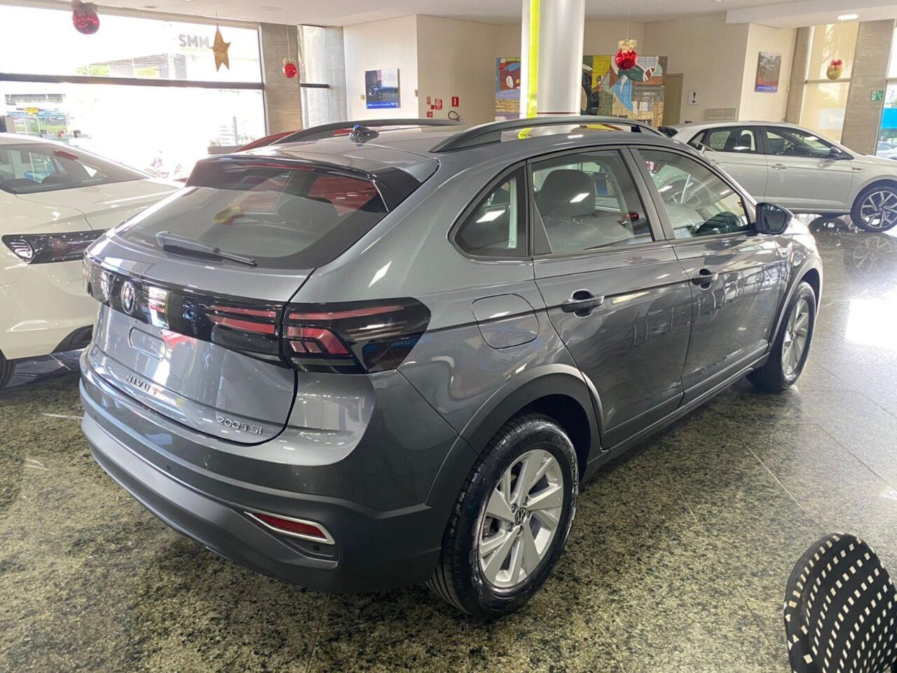 volkswagen nivus 1.0 200 tsi total flex comfortline automatico wmimagem10011556836 Disponível em duas opções de acabamento, o Volkswagen Nivus apresenta motorização turbo e oferece descontos atrativos para empresas e produtores rurais