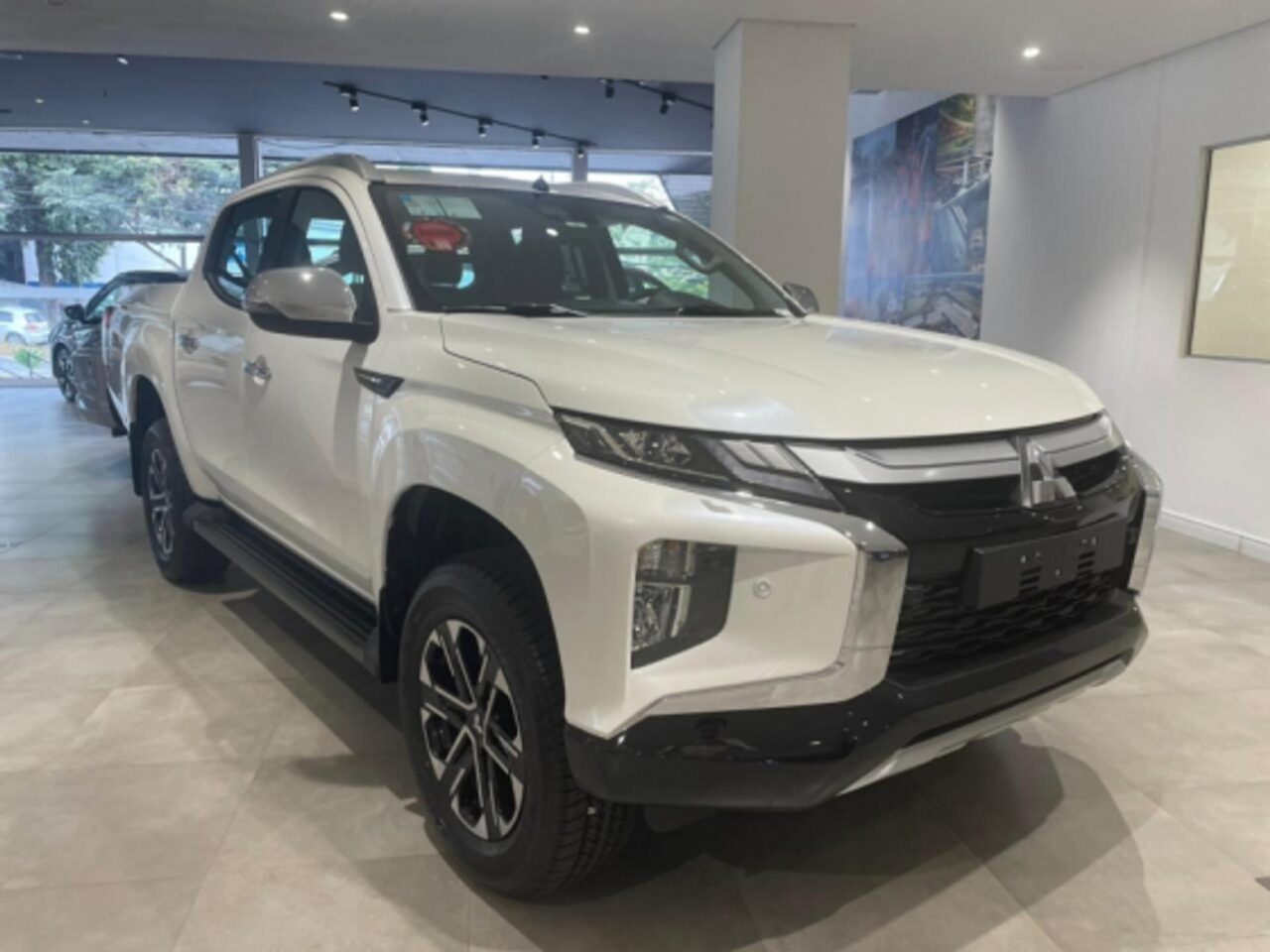 mitsubishi l200 triton 2.4 16v turbo diesel sport hpes cd 4p 4x4 automatico wmimagem16052358344 1 1 Com uma excelente capacidade de carga e um ótimo custo-benefício, a Mitsubishi L200 Triton Sport HPE 2024 oferece uma ampla lista de equipamentos