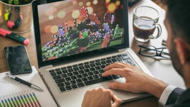 online gambling concept man at work casino chips on a computer screen